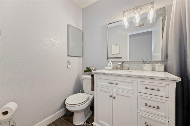 5996 Winncliff Dr, Jurupa Valley, CA 92509 - bathroom with vanity, toilet, and baseboards