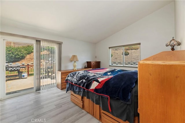 5996 Winncliff Dr, Jurupa Valley, CA 92509 - bedroom with access to outside, vaulted ceiling, and light wood-style floors