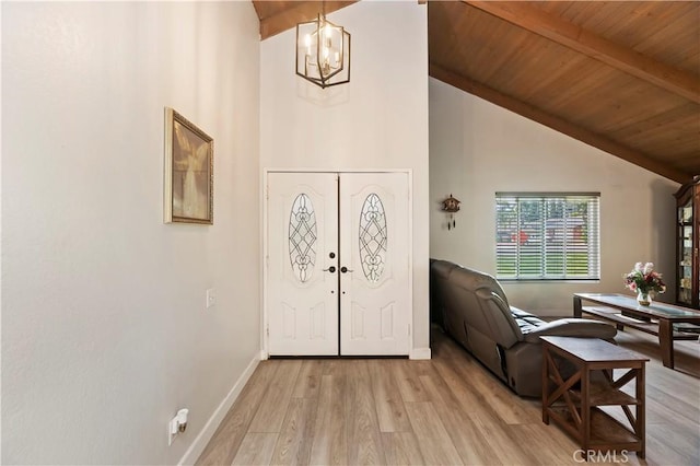 5996 Winncliff Dr, Jurupa Valley, CA 92509 - foyer entrance with a chandelier, wood ceiling with exposed beams, light wood-style flooring, high vaulted ceiling, and baseboards