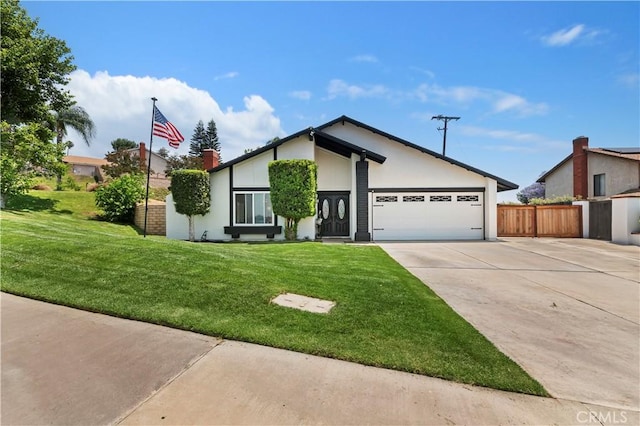 5996 Winncliff Dr, Jurupa Valley, CA 92509 - view of front of property featuring driveway, an attached garage, and stucco siding