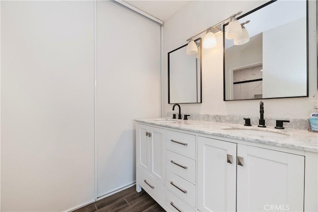 5996 Winncliff Dr, Jurupa Valley, CA 92509 - full bathroom featuring double vanity and wood finished floors