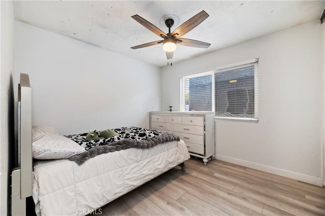5996 Winncliff Dr, Jurupa Valley, CA 92509 - bedroom with light wood-style flooring, baseboards, and a ceiling fan
