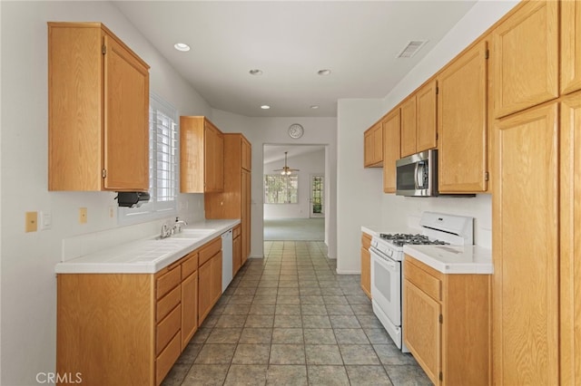 23723 Corte Andar, Murrieta, CA 92562 - kitchen with white appliances, a sink, baseboards, recessed lighting, and ceiling fan