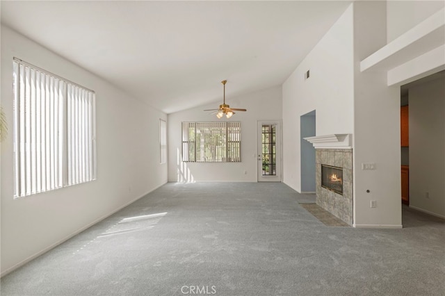 23723 Corte Andar, Murrieta, CA 92562 - unfurnished living room featuring carpet floors, a fireplace, ceiling fan, vaulted ceiling, and baseboards