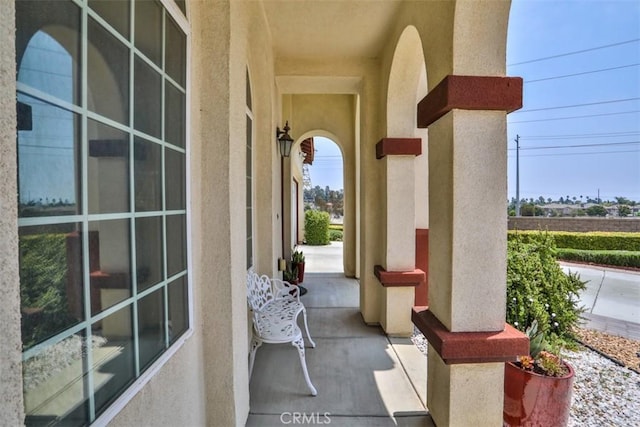 13256 Garcia Ct, Rancho Cucamonga, CA 91739 - doorway to property featuring stucco siding and covered porch