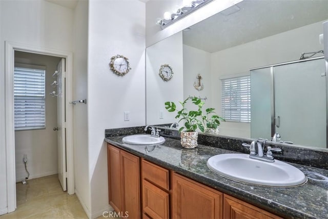 13256 Garcia Ct, Rancho Cucamonga, CA 91739 - bathroom with double vanity, tile patterned flooring, and an enclosed shower