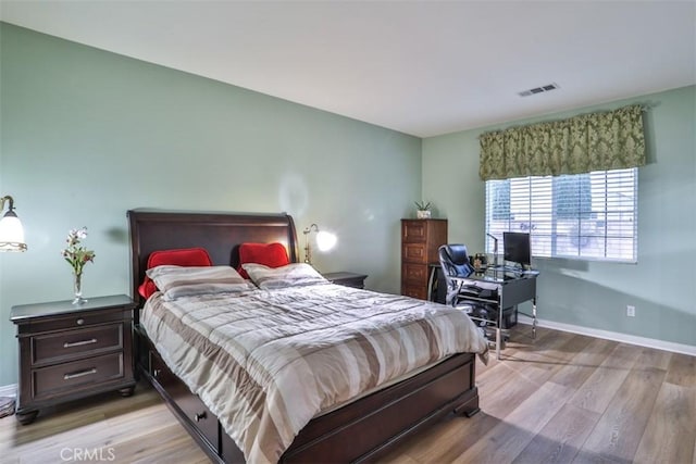 13256 Garcia Ct, Rancho Cucamonga, CA 91739 - bedroom with light wood-style flooring, baseboards, and a desk