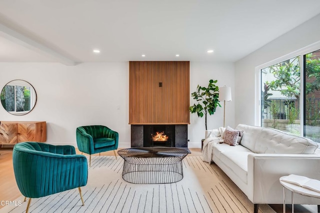 12938 Guadalajara Cir, Cerritos, CA 90703 - living room with recessed lighting, wood finished floors, and a large fireplace