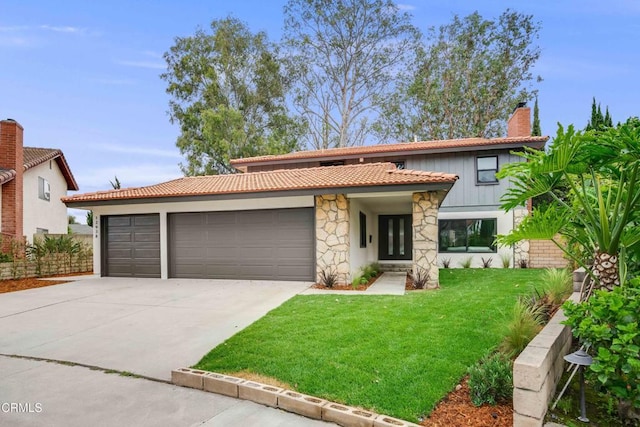 12938 Guadalajara Cir, Cerritos, CA 90703 - mediterranean / spanish house with an attached garage, driveway, stone siding, a front lawn, and a chimney