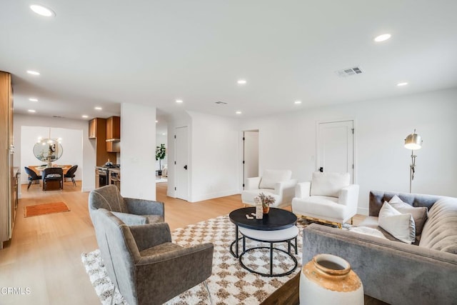 12938 Guadalajara Cir, Cerritos, CA 90703 - living area featuring light wood-type flooring, recessed lighting, and baseboards