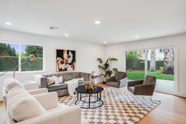 12938 Guadalajara Cir, Cerritos, CA 90703 - living area with healthy amount of natural light, recessed lighting, and wood finished floors