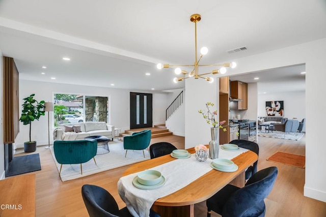 12938 Guadalajara Cir, Cerritos, CA 90703 - dining area with light wood finished floors, stairs, a chandelier, and recessed lighting