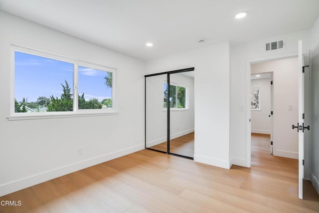 12938 Guadalajara Cir, Cerritos, CA 90703 - unfurnished bedroom with light wood finished floors, baseboards, recessed lighting, and a closet