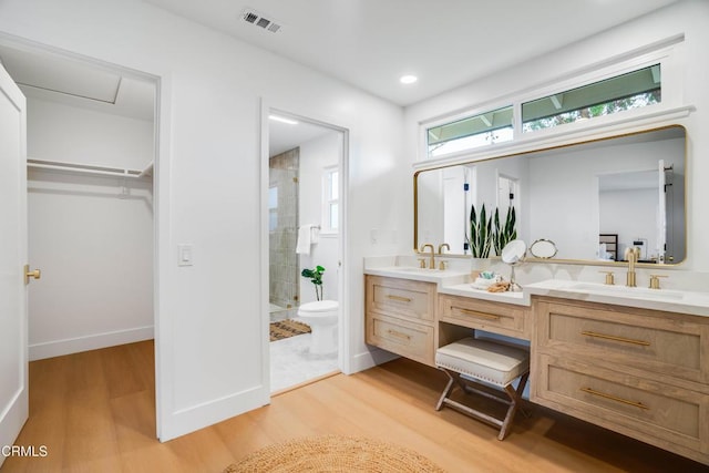 12938 Guadalajara Cir, Cerritos, CA 90703 - full bathroom featuring double vanity, a stall shower, wood finished floors, a spacious closet, and recessed lighting