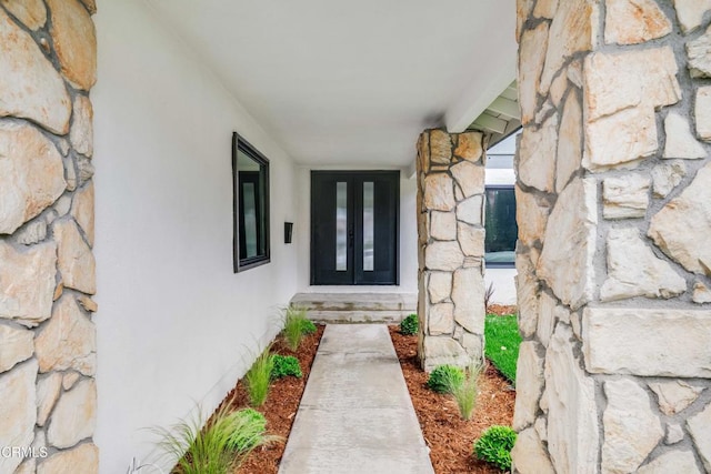 12938 Guadalajara Cir, Cerritos, CA 90703 - property entrance with stone siding, french doors, and stucco siding