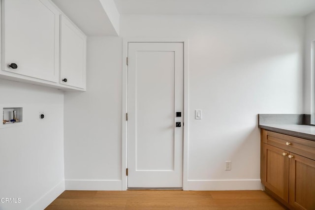 12938 Guadalajara Cir, Cerritos, CA 90703 - washroom with cabinet space, washer hookup, baseboards, hookup for an electric dryer, and light wood finished floors