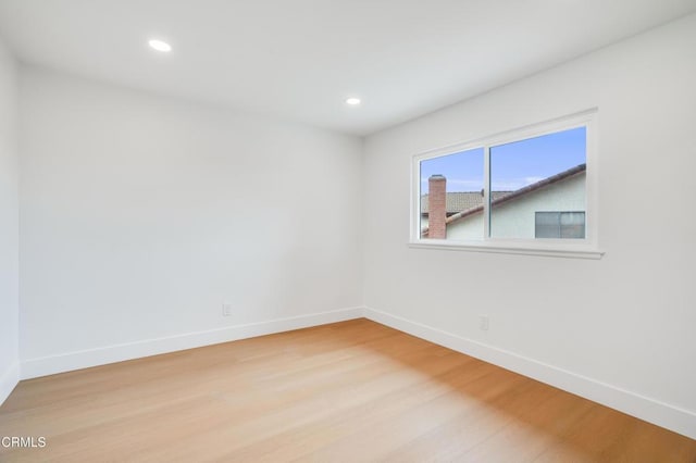 12938 Guadalajara Cir, Cerritos, CA 90703 - spare room featuring baseboards, light wood finished floors, and recessed lighting