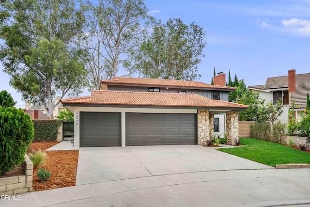 12938 Guadalajara Cir, Cerritos, CA 90703 - view of front of home with a garage, concrete driveway, a tiled roof, stone siding, and a chimney