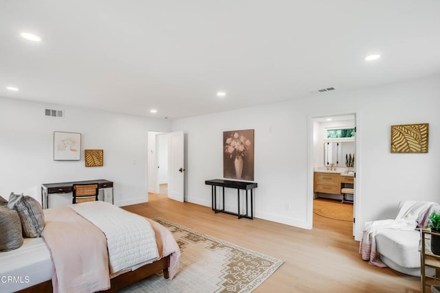 12938 Guadalajara Cir, Cerritos, CA 90703 - bedroom with light wood-style flooring, recessed lighting, and baseboards