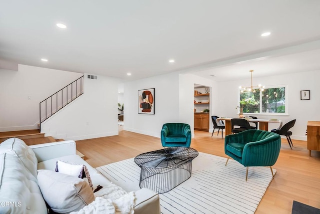 12938 Guadalajara Cir, Cerritos, CA 90703 - living area with light wood-style flooring, a chandelier, stairway, recessed lighting, and baseboards