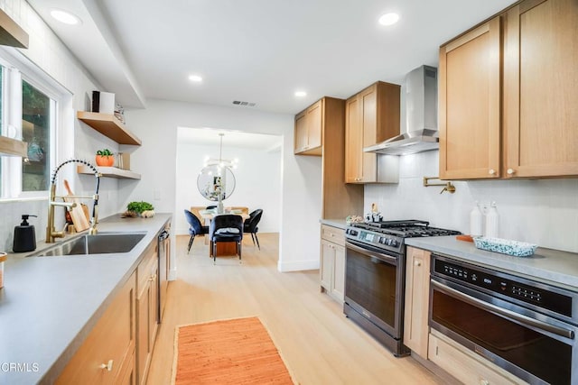 12938 Guadalajara Cir, Cerritos, CA 90703 - kitchen with wall chimney range hood, stainless steel appliances, a sink, light wood-style flooring, and open shelves