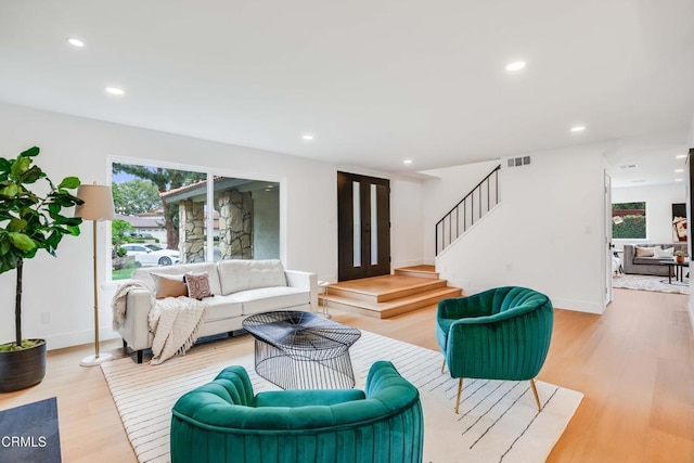 12938 Guadalajara Cir, Cerritos, CA 90703 - living area featuring plenty of natural light, wood finished floors, stairway, recessed lighting, and baseboards