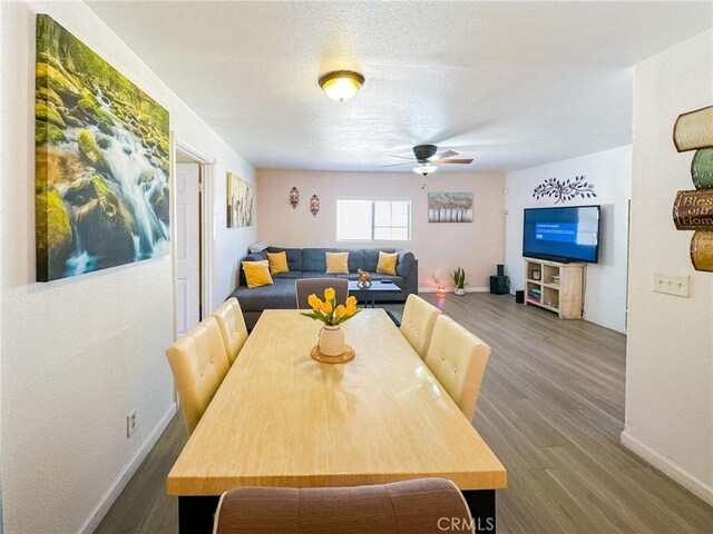 45439 Lorimer Ave, Lancaster, CA 93534 - dining area featuring baseboards, wood finished floors, and ceiling fan