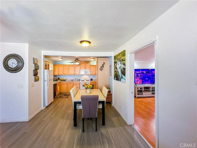 45439 Lorimer Ave, Lancaster, CA 93534 - dining space with wood finished floors, baseboards, and a ceiling fan