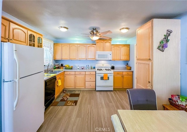 45439 Lorimer Ave, Lancaster, CA 93534 - kitchen featuring white appliances, light brown cabinetry, light wood-style flooring, a sink, and light countertops