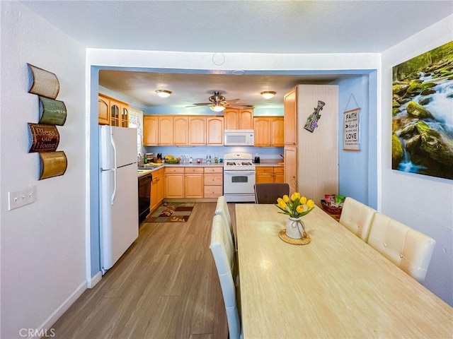 45439 Lorimer Ave, Lancaster, CA 93534 - kitchen with white appliances, light wood-type flooring, light countertops, light brown cabinets, and ceiling fan