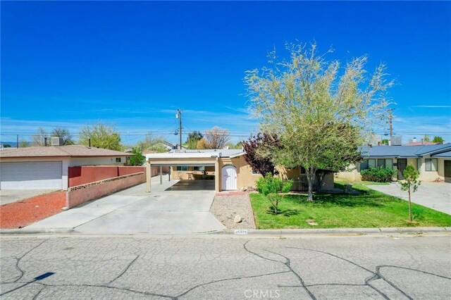 45439 Lorimer Ave, Lancaster, CA 93534 - single story home featuring concrete driveway, a carport, and stucco siding