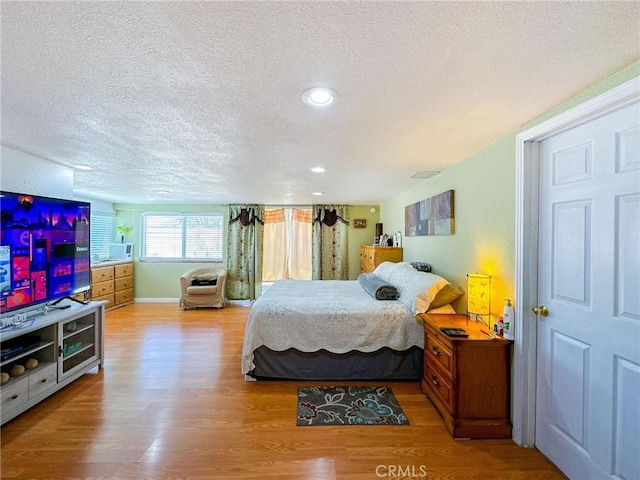45439 Lorimer Ave, Lancaster, CA 93534 - bedroom with a textured ceiling, wood finished floors, recessed lighting, and baseboards