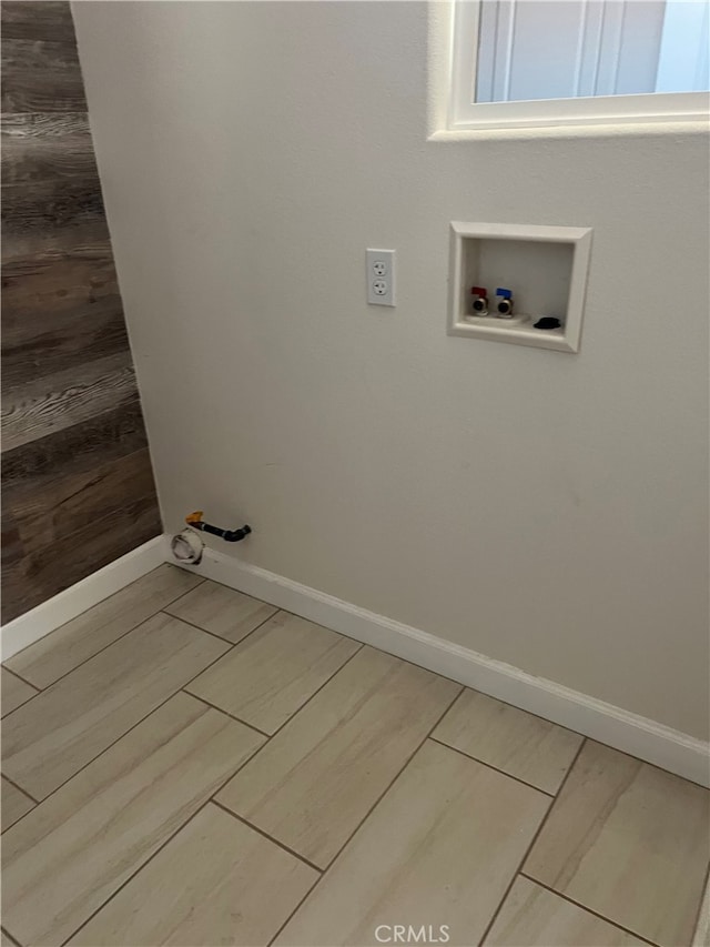 7448 Del Rio Vis, Yucca Valley, CA 92284 - laundry area with hookup for a washing machine, baseboards, hookup for a gas dryer, and wood tiled floors