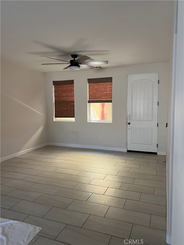7448 Del Rio Vis, Yucca Valley, CA 92284 - spare room with ceiling fan and baseboards