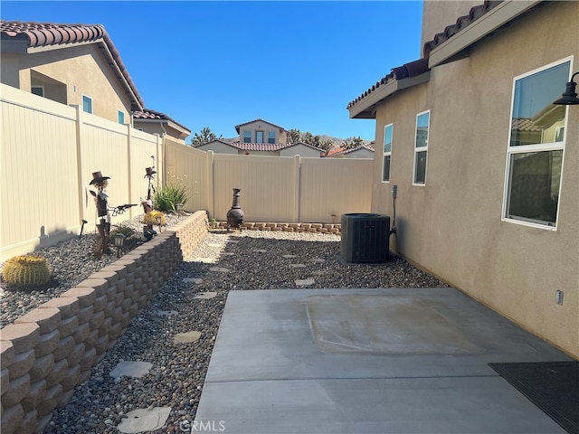 7448 Del Rio Vis, Yucca Valley, CA 92284 - fenced backyard featuring a patio and central AC