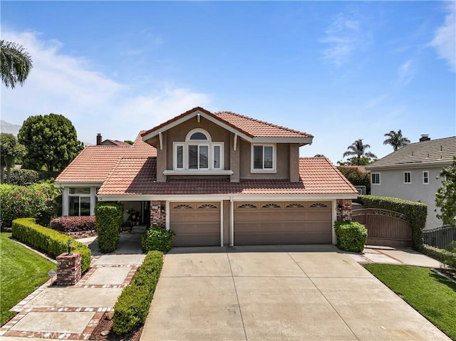 2074 Redgrove Way, Upland, CA 91784 - view of front of property featuring a tile roof, driveway, stucco siding, and a garage