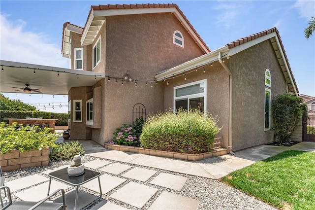 2074 Redgrove Way, Upland, CA 91784 - rear view of property featuring a patio area, stucco siding, a ceiling fan, and a tiled roof