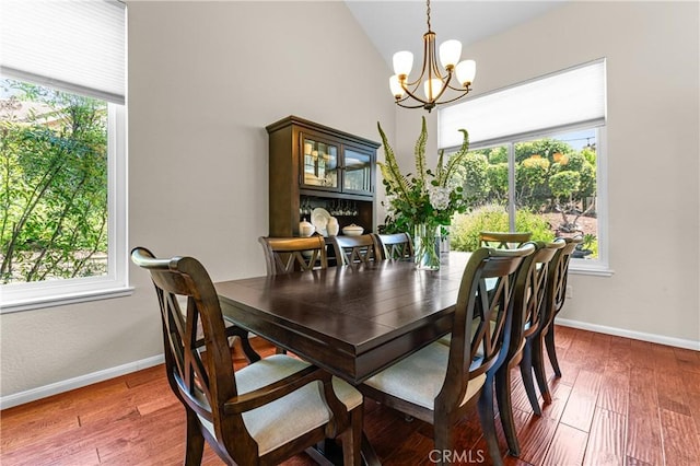2074 Redgrove Way, Upland, CA 91784 - dining space featuring a chandelier, healthy amount of natural light, wood finished floors, and lofted ceiling