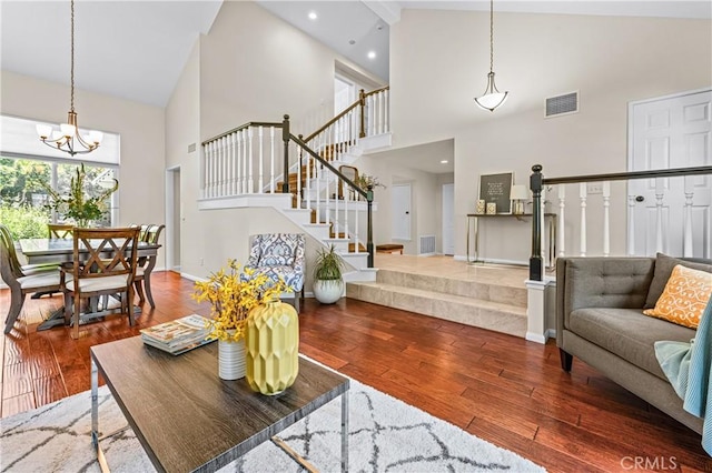 2074 Redgrove Way, Upland, CA 91784 - living area featuring high vaulted ceiling, stairs, hardwood / wood-style flooring, a chandelier, and recessed lighting