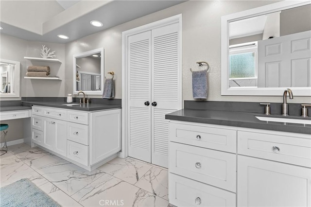 2074 Redgrove Way, Upland, CA 91784 - bathroom with recessed lighting, two vanities, marble look tiles, and a closet