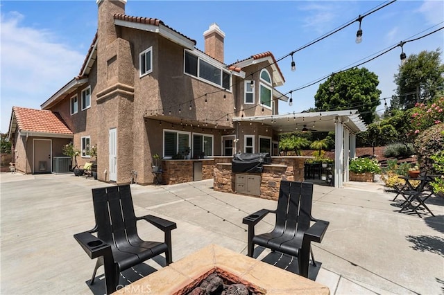2074 Redgrove Way, Upland, CA 91784 - view of patio with an outdoor fire pit and an outdoor kitchen
