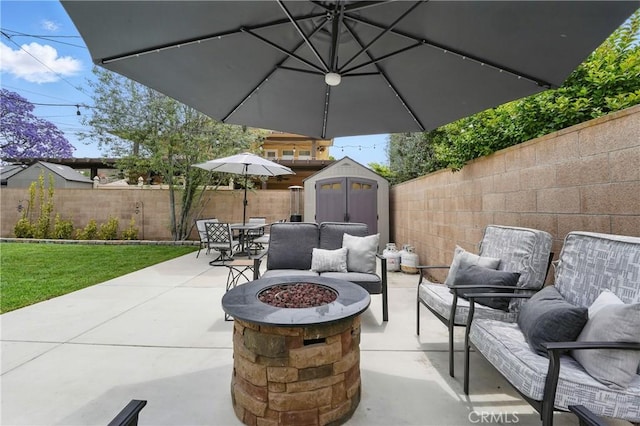 3848 Ocana Ave, Long Beach, CA 90808 - fenced backyard with a storage unit, a patio area, outdoor dining area, and an outdoor living space with a fire pit