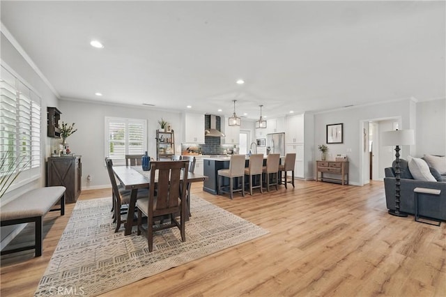 3848 Ocana Ave, Long Beach, CA 90808 - dining space with crown molding, light wood-style floors, and recessed lighting