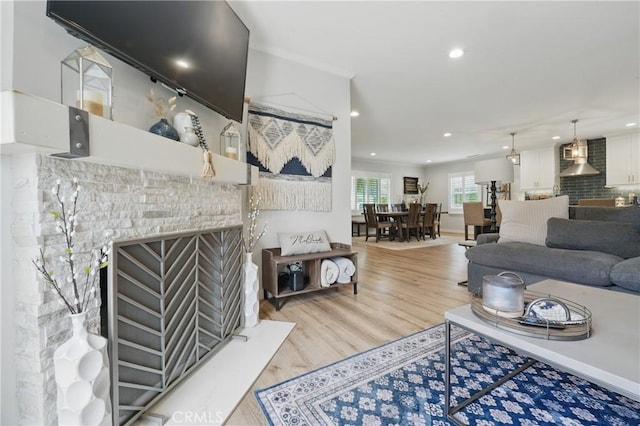 3848 Ocana Ave, Long Beach, CA 90808 - living area featuring wood finished floors, recessed lighting, and a fireplace with flush hearth