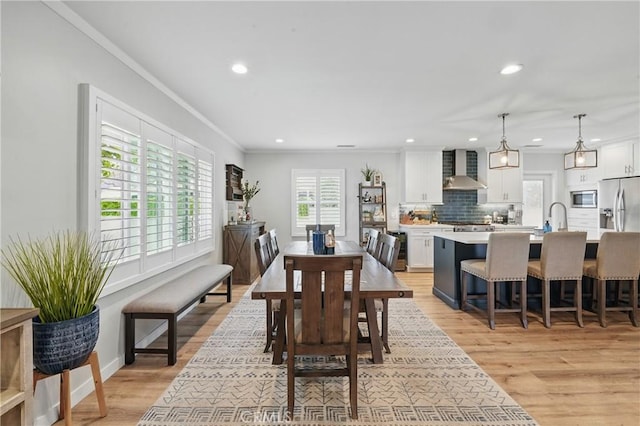 3848 Ocana Ave, Long Beach, CA 90808 - dining area with recessed lighting, light wood-style flooring, and ornamental molding