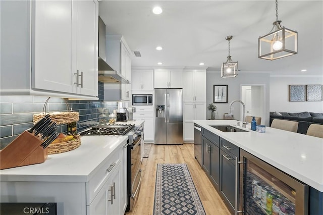 3848 Ocana Ave, Long Beach, CA 90808 - kitchen featuring stainless steel appliances, wall chimney range hood, wine cooler, light wood-style floors, and white cabinets