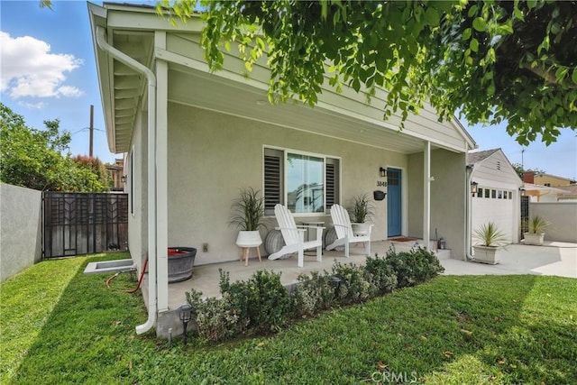 3848 Ocana Ave, Long Beach, CA 90808 - view of front of house with an attached garage, stucco siding, concrete driveway, and a porch