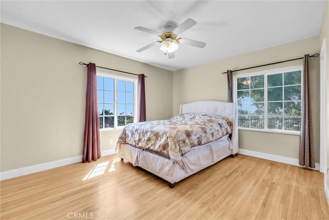 918 Dorothea Rd, La Habra Heights, CA 90631 - bedroom featuring multiple windows, light wood-style flooring, and baseboards