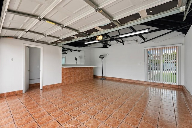 1440 E Abila St, Carson, CA 90745 - garage with baseboards and a garage door opener
