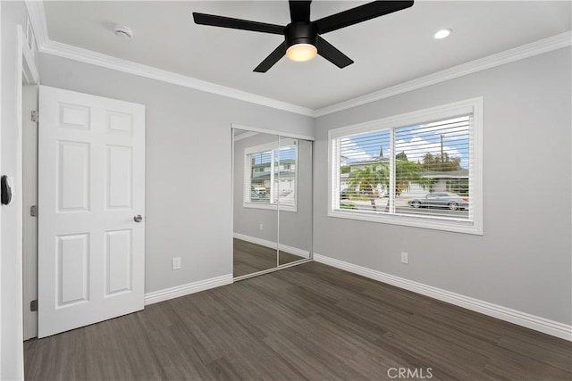 1440 E Abila St, Carson, CA 90745 - unfurnished bedroom featuring dark wood-type flooring, baseboards, crown molding, a closet, and a ceiling fan